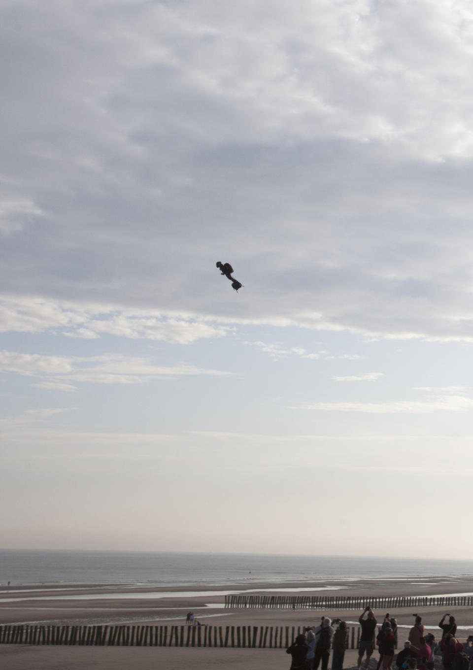 Franky Zapata, a 40-year-old inventor, takes to the air in Sangatte, Northern France, at the start of his attempt to cross the channel from France to England, aboard his flyboard, Sunday Aug. 4, 2019. Zapata will try again Sunday, to traverse the English Channel on a flying board after his first attempt failed when he crashed into a refueling boat 20 kilometers (12 miles) into the trip. (AP Photo/Michel Spingler)