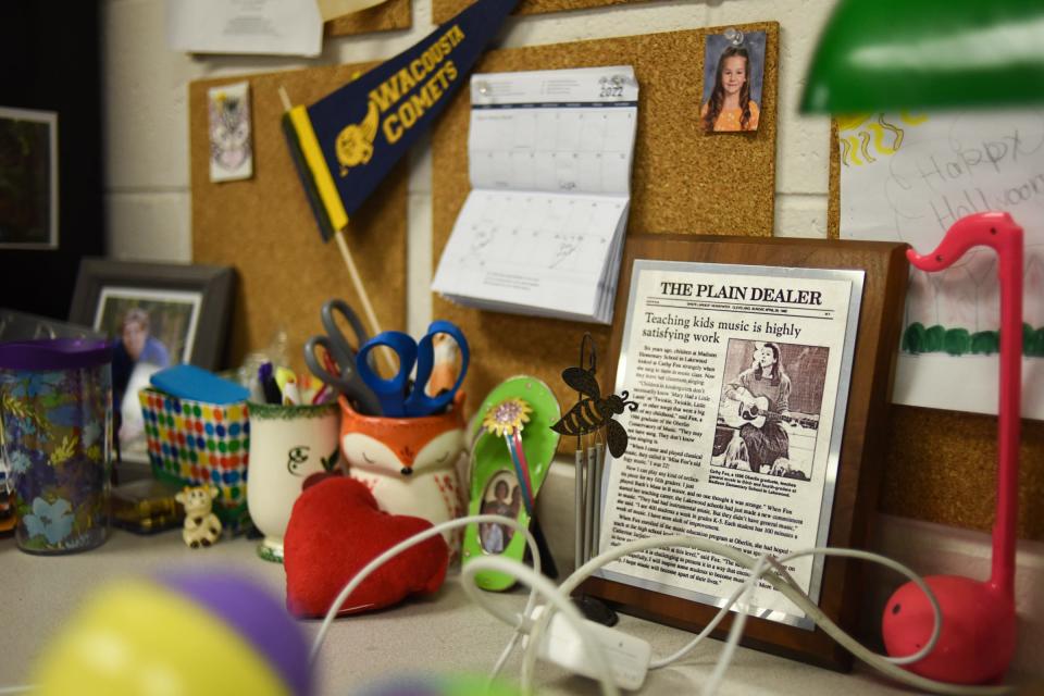 A plaque with a 1986 newspaper article is displayed on Wacousta Elementary School teacher Cathy Fox's desk Monday, Feb. 7, 2022. Fox has been recognized as the 2022 music educator of the year by the Michigan Association for Music Education. She began her teaching career in 1986.