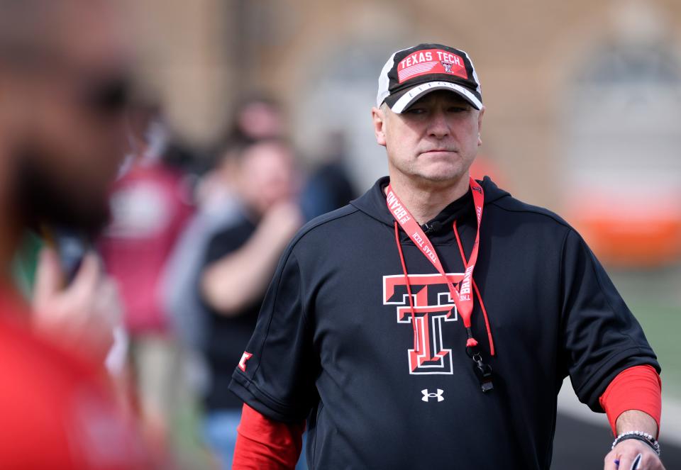 Texas Tech coach Joey McGuire oversees the Red Raiders' first session of spring football practice Tuesday outside the Sports Performance Center.