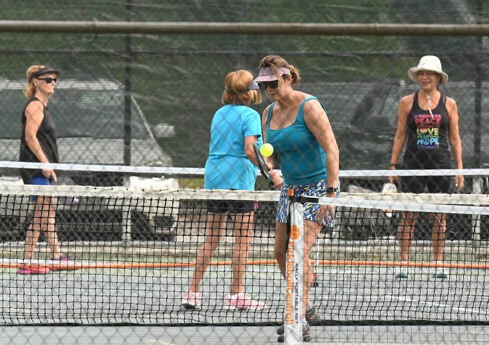 Players enjoy a game of pickleball at Greenfield Lake in Wilmington.