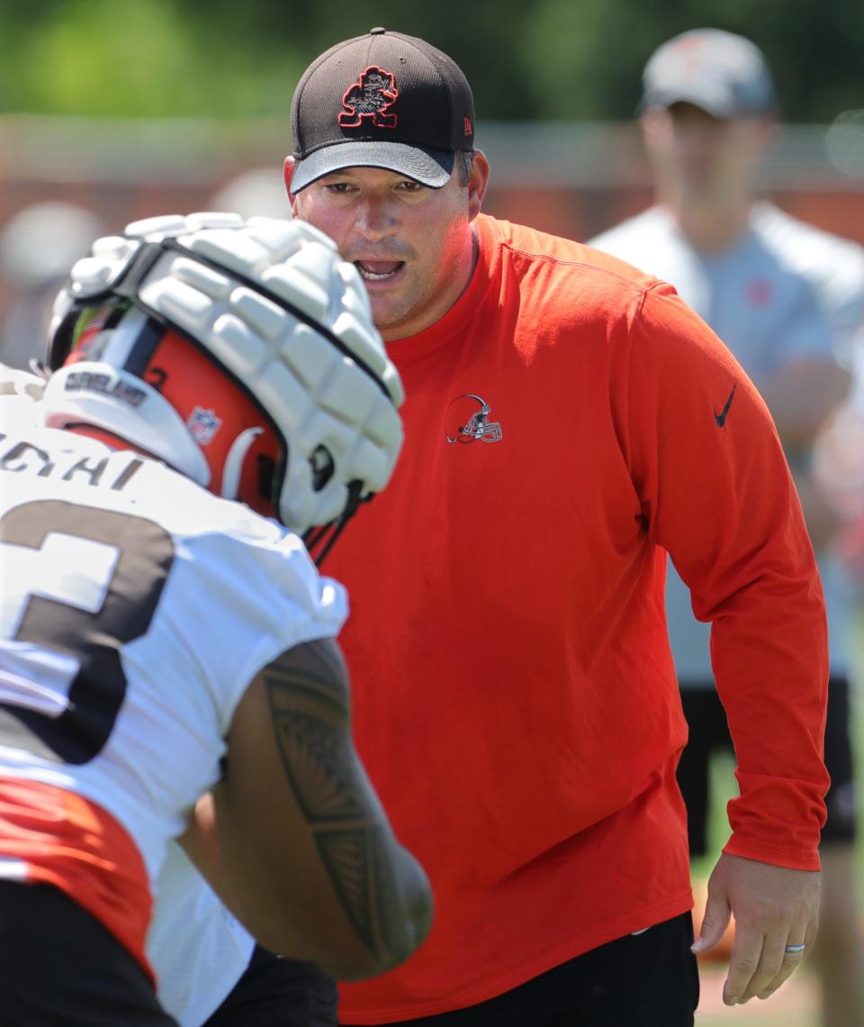 Cleveland Browns defensive line coach Chris Kiffin runs a pass rushing drill during training camp on Saturday, July 30, 2022 in Berea.
