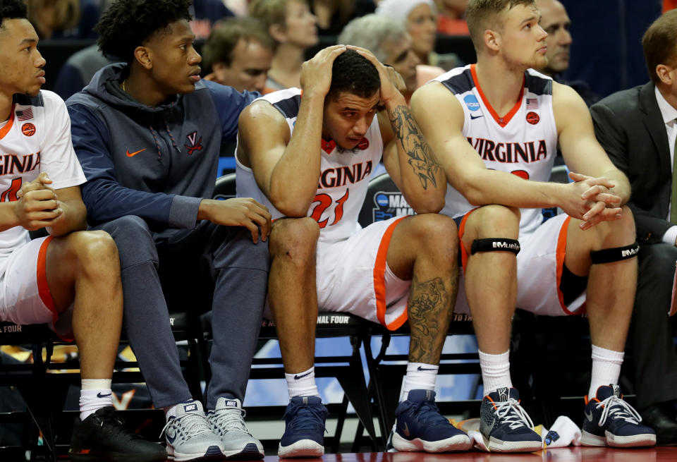 <p>Isaiah Wilkins #21 of the Virginia Cavaliers reacts to their 74-54 loss to the UMBC Retrievers during the first round of the 2018 NCAA Men’s Basketball Tournament at Spectrum Center on March 16, 2018 in Charlotte, North Carolina. (Photo by Streeter Lecka/Getty Images) </p>