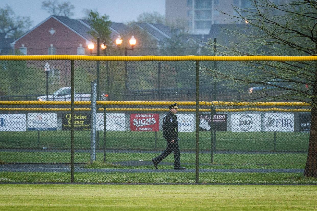 <p>A Capitol Police officer walks the perimeter of the field as members of the Republican Congressional Baseball Team hold practice at Simpson Field on 25 April 2018 in Alexandria, Virginia. The practice was the first time the members of Congress have returned to the scene of last year's shooting where House Majority Whip Rep. Steve Scalise (R-La.), and four others, including two Capitol Police officers, were wounded when a gunman opened fire on 14 June 2017.  </p> ((Photo by Pete Marovich/Getty Images))