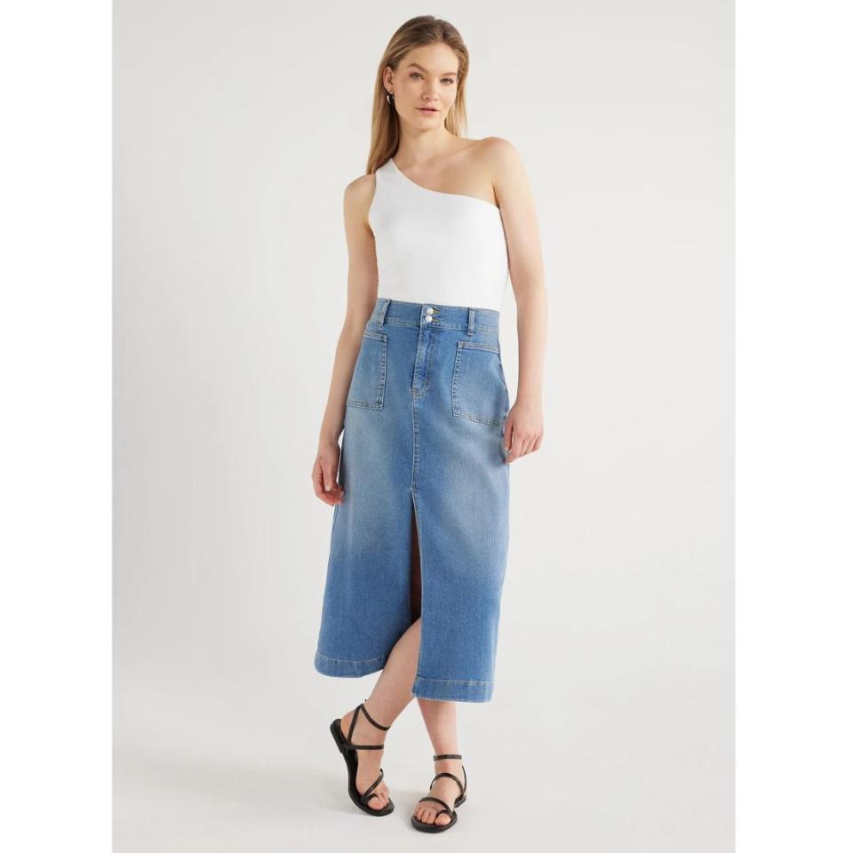 model wearing maxi denim skirt with white one shoulder top