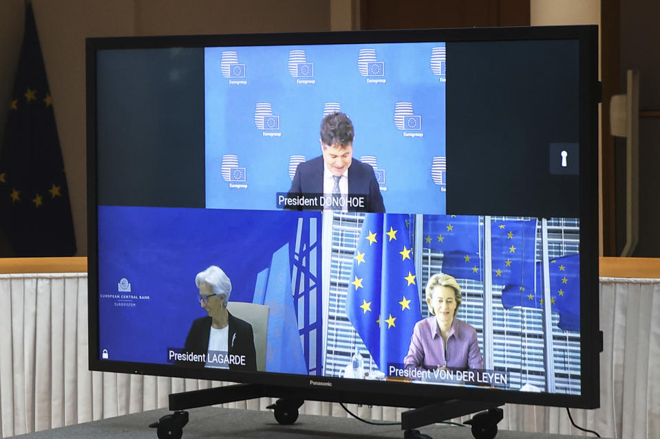 Eurogroup President Paschal Donohoe, top, European Central Bank President Christine Lagarde, bottom left, and European Commission President Ursula von der Leyen join an inter-institutional actors video conference meeting with European Council President Charles Michel at the European Council headquarters in Brussels, Thursday, March 11, 2021. (Aris Oikonomou, Pool Photo via AP)