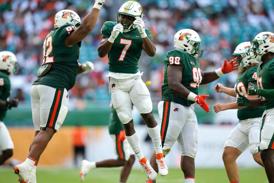 Florida A&M defensive back Tevin Griffey (7) celebrates with defensive lineman Gentle Hunt (92) after making a play during the second half of the Orange Blossom Classic NCAA college football game against Jackson State, Sunday, Sept. 3, 2023, in Miami Gardens, Fla. (AP Photo/Lynne Sladky)