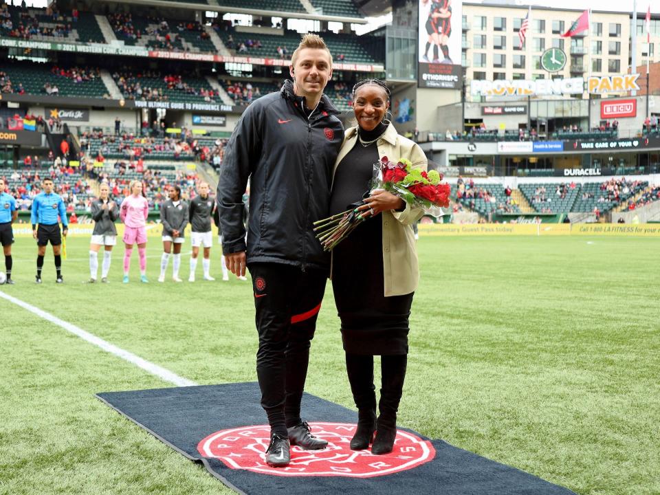 Pierre Soubrier (left) poses with his wife, Portland Thorns star Crystal Dunn.