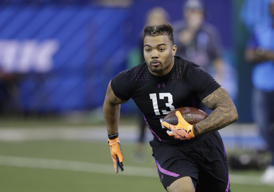 LSU running back Derrius Guice runs a drill during the NFL football scouting combine in Indianapolis. (AP)