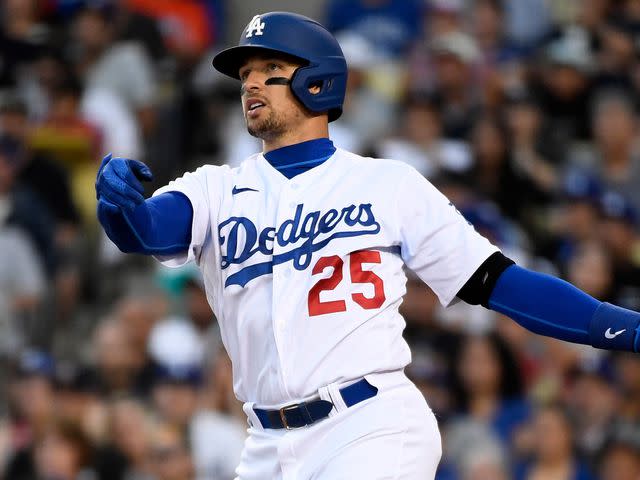 <p>Kevork Djansezian/Getty</p> Trayce Thompson hits a three-run home run against starting pitcher Kyle Freeland of the Colorado Rockies during the fifth inning at Dodger Stadium on July 4, 2022.