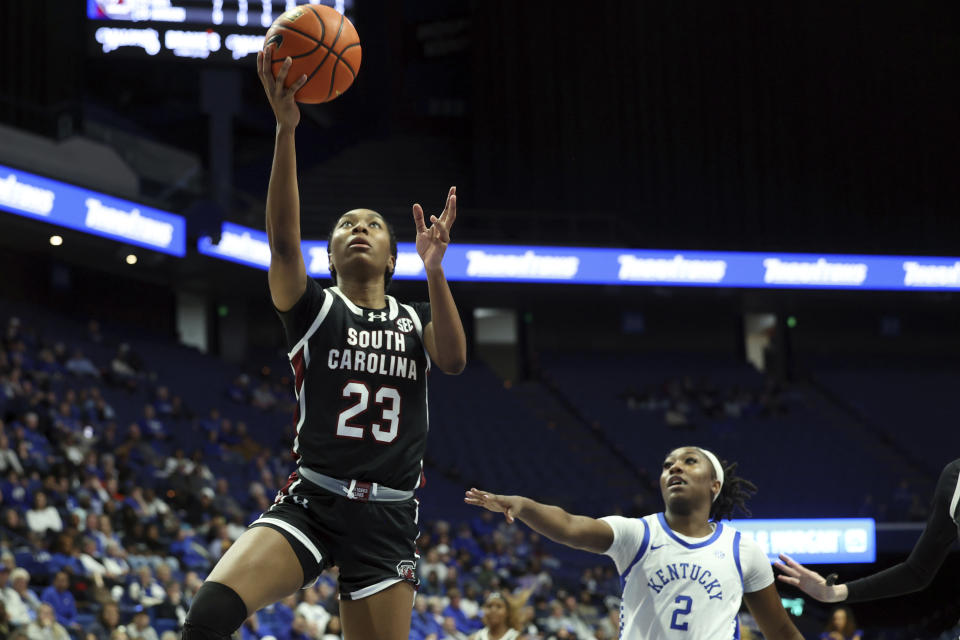 South Carolina's Bree Hall (23) goes to the basket as Kentucky's Saniah Tyler (2) watches during the second half of an NCAA college basketball game Sunday, Feb. 25, 2024, in Lexington, Ky. South Carolina won 103-55. (AP Photo/James Crisp)