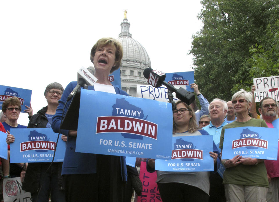 FILE - In this Sept. 20, 2018 file photo, U.S. Sen. Tammy Baldwin, D-Wis. speaks to supporters and talks about her support for the national health care law before encouraging early voting in Madison, Wis. A significant portion of US voters remains hesitant about supporting an LGBT candidate for president, according to a new AP-NORC poll. Yet many LGBT candidates in major non-presidential races have overcome such attitudes, and political experts predict the path for future LGBT office-seekers will steadily grow smoother. (AP Photo/Scott Bauer)