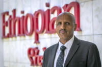 FILE - In this Saturday, March 23, 2019 file photo, Tewolde Gebremariam, Chief Executive Officer of Ethiopian Airlines, poses for a photograph after speaking to The Associated Press at Bole International Airport in Addis Ababa, Ethiopia. Questions are swirling in Africa and elsewhere over the financial wisdom of sustaining prestige carriers that have a tiny share of an aviation market that sees no recovery in sight as sub-Saharan Africa faces its first recession in a quarter-century amid coronavirus-related travel restrictions. (AP Photo/Mulugeta Ayene, File)