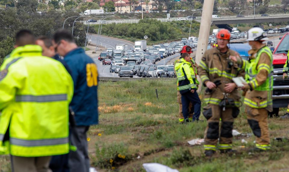 Southbound traffic backed up after a bus rolled down an embankment off Interstate 15 in North San Diego County Saturday, Feb. 22, 2020, killing several people and injuring others.
