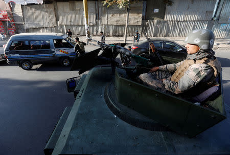 Afghan policemen guard a checkpoint during the parliamentary election in Kabul, Afghanistan October 21, 2018. REUTERS/Omar Sobhani