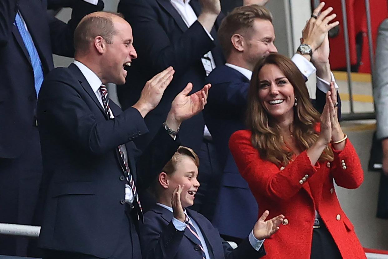 The British Prince William, Duke of Cambridge, his wife Kate, Duchess of Cambridge, and their son Prince George celebrate the 1:0.