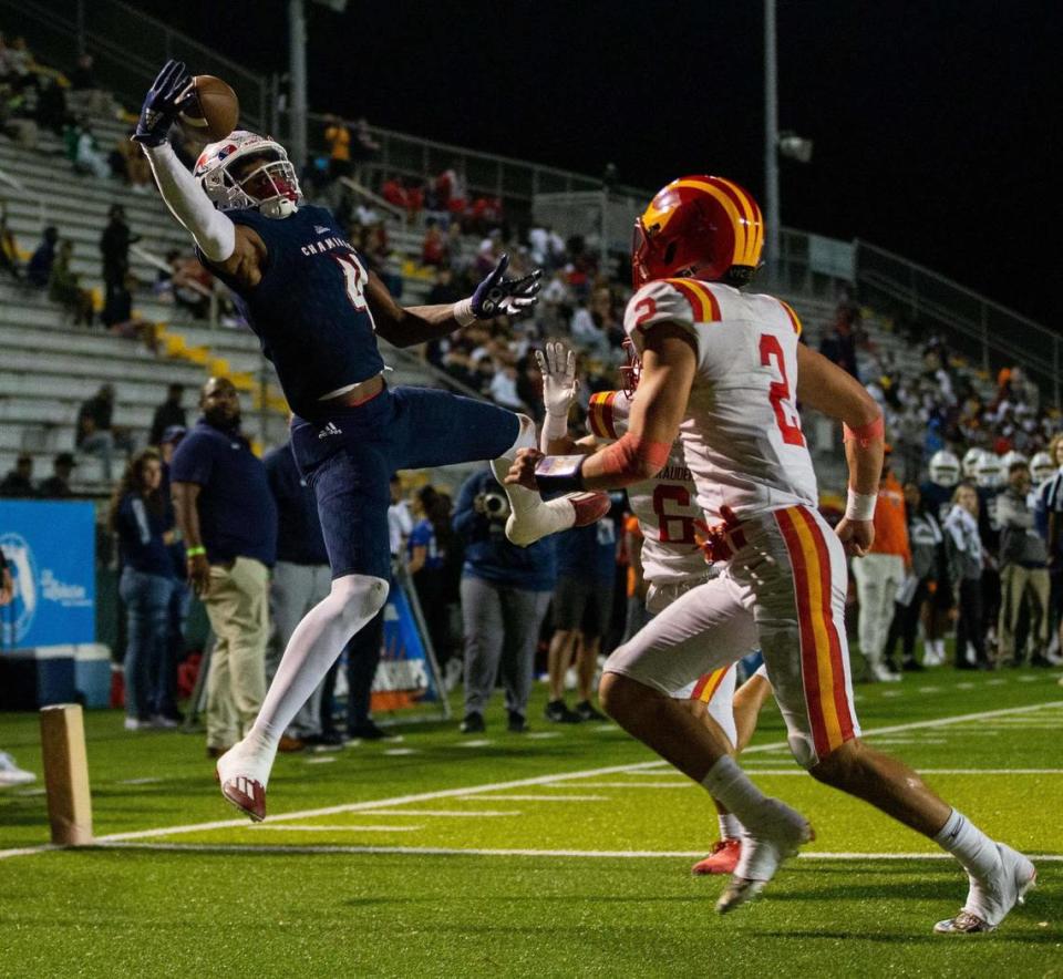 Chaminade wide receiver Jeremiah Smith (4) jumps and reaches out to catch a pass with one hand for a touchdown. The Chaminade Lions lead the Clearwater Central Catholic Marauders 28-0 at the half of the Class 1M State Championship game at Gene Cox Stadium in Tallahassee, Florida on Thursday, Dec. 8, 2022.