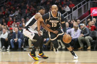 Atlanta Hawks guard Vince Carter (15) drives on Los Angeles Clippers guard Terance Mann (14) in the first half of an NBA basketball game Wednesday, Jan. 22, 2020, in Atlanta, Ga. (AP Photo/Brett Davis)