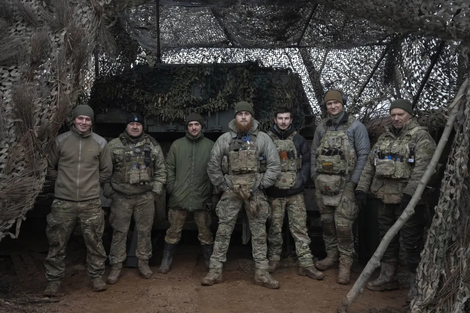 FILE - Soldiers of 12th Special Forces Brigade Azov of the National Guard pose for a photo at the 155mm self-propelled gun M109 Paladin at the front line, near Kreminna, Luhansk region, Ukraine, Sunday, Jan. 28, 2024. The U.S. has removed restrictions on the transfer of American weapons and training to a high-profile Ukrainian military unit with a checkered past, the State Department said on Tuesday, June 11, 2024. (AP Photo/Efrem Lukatsky, File)