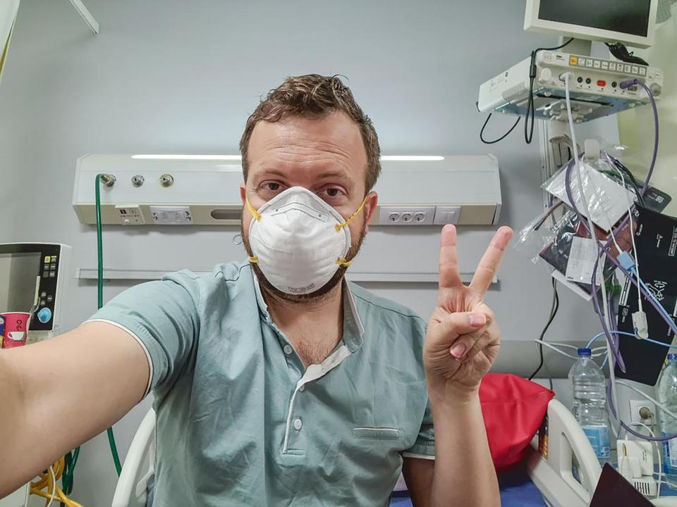 In this photo provided by Matt Swider, posted on Twitter on March 9, 2020, American tourist Matt Swider, takes a selfie while in quarantine in the north coast city of Marsa Matrouh, Egypt. When Swider was tested for the new coronavirus on his Nile cruise in Egypt’s tourist hub of Luxor, he assumed the government was just taking extreme precautions. The healthy 35-year-old tech editor living in New York, couldn’t have imagined that he would be confined indefinitely to a remote hospital on the country’s north coast. For most people, the new coronavirus causes only mild or moderate symptoms. For some it can cause more severe illness. (Matt Swider via AP)