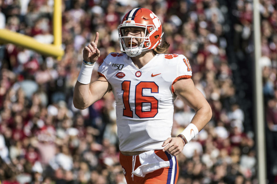 FILE - In this Nov. 30, 2019, file photo, Clemson quarterback Trevor Lawrence (16) celebrates a touchdown against South Carolina during the first half of an NCAA college football game in Columbia, S.C. Clemson is preseason No. 1 in The Associated Press Top 25, Monday, Aug. 24, 2020, a poll featuring nine Big Ten and Pac-12 teams that gives a glimpse at what’s already been taken from an uncertain college football fall by the pandemic. (AP Photo/Sean Rayford, File)
