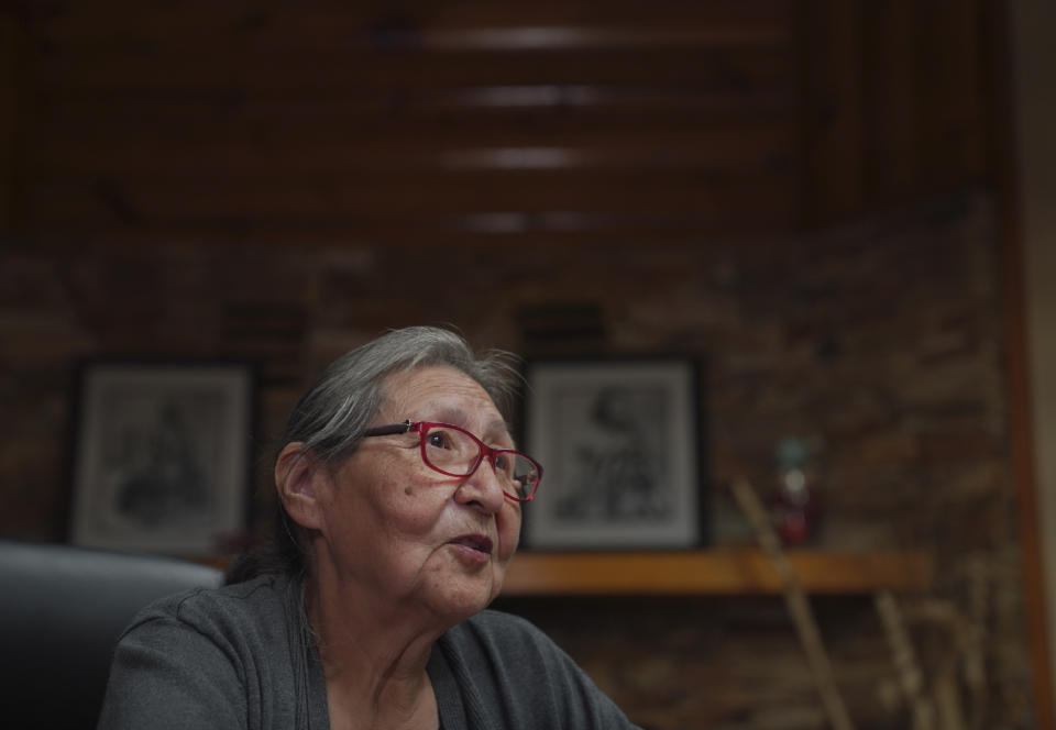 Rose Pipestem, a survivor of the Ermineskin residential school, sits for an interview on Tuesday, July 19, 2022, in Maskwacis, Alberta. Pipestem was placed in the residential school at three-years-old after her mother died. She doesn't have conscious memories of abuse at the school, but she said a classmate told her years later that a nun had beaten her until she bled. (AP Photo/Jessie Wardarski)