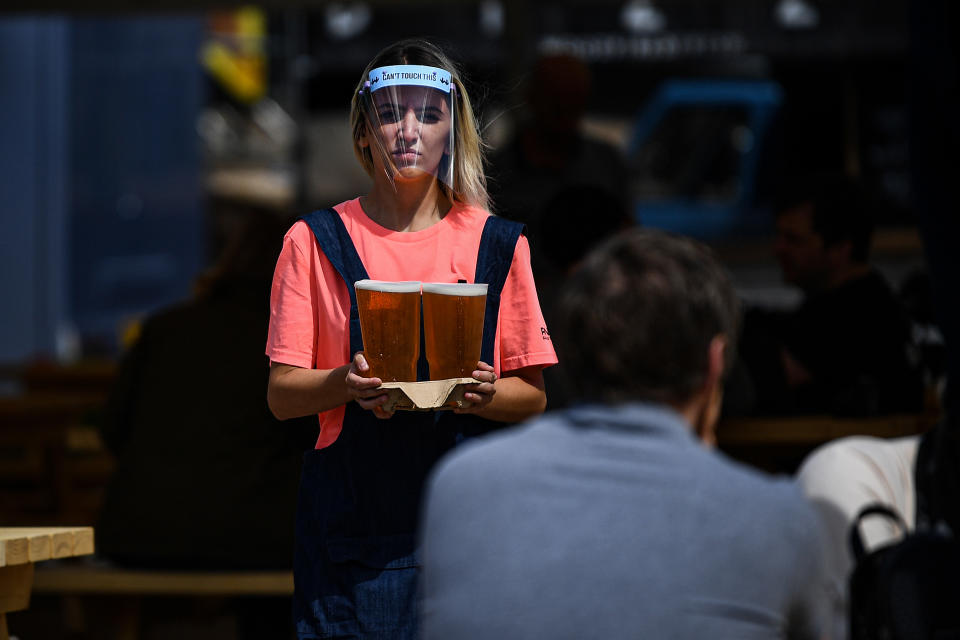 Pubs are now open in England but staff must wear protective equipment. (Getty)