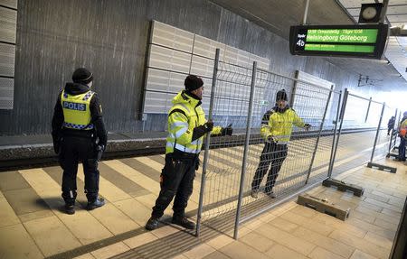 A temporary fence is erected between domestic and international tracks is seen at Hyllie train station in southern Malmo, Sweden, January 3, 2016. REUTERS/Johan Nilsson/TT News Agency