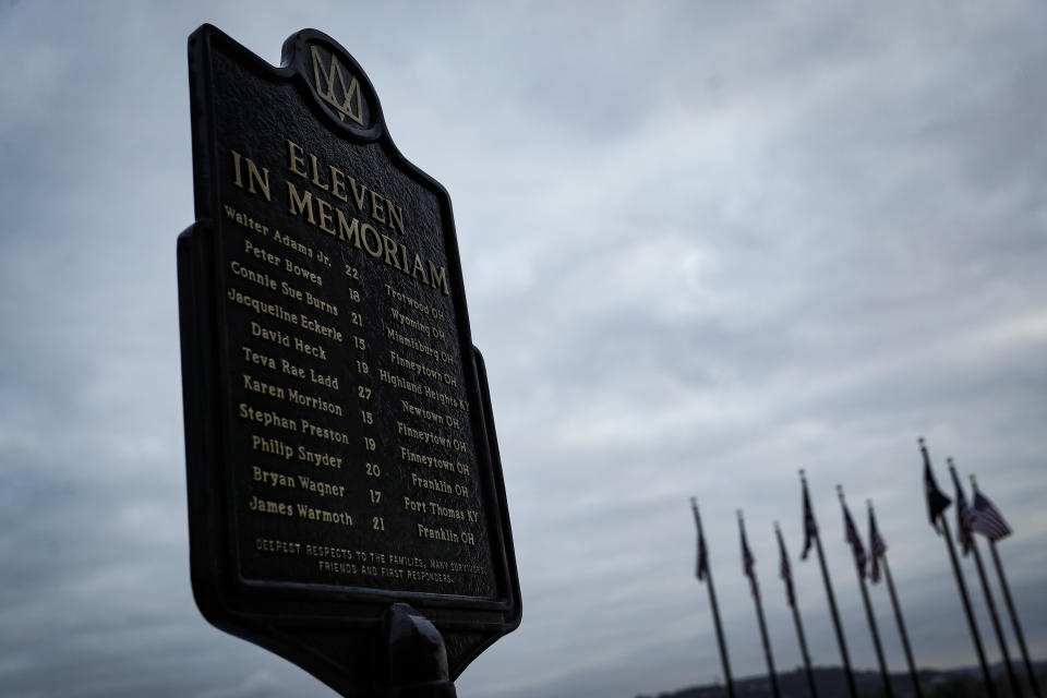 In this Wednesday, Nov. 20, 2019 photo, a memorial plaque for eleven concertgoers killed at a 1979 concert stands between Great American Ballpark and Heritage Bank Arena, in Cincinnati. Tragedy four decades ago linked the British rock band The Who to a small suburban city in Ohio. In recent years, members of the community and the band have bonded through a project to memorialize the three teens from Finneytown who were killed in a frantic stampede of people trying to get into The Who’s Dec. 3, 1979, Cincinnati concert. (AP Photo/John Minchillo)