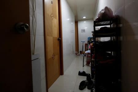 A corridor shared by four sub-divided units is seen in Hong Kong, China January 6, 2017. REUTERS/Bobby Yip