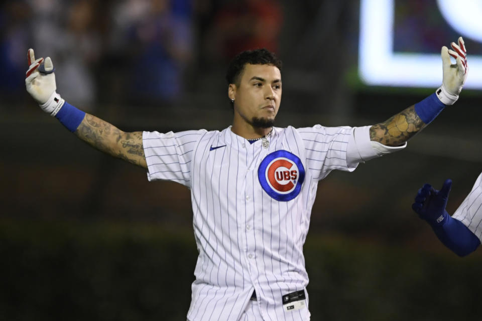 Chicago Cubs' Javier Baez celebrates after hitting a walk-off single in the ninth inning to defeat the Cincinnati Reds 6-5 in a baseball game, late Monday, July 26, 2021, in Chicago. (AP Photo/Paul Beaty)