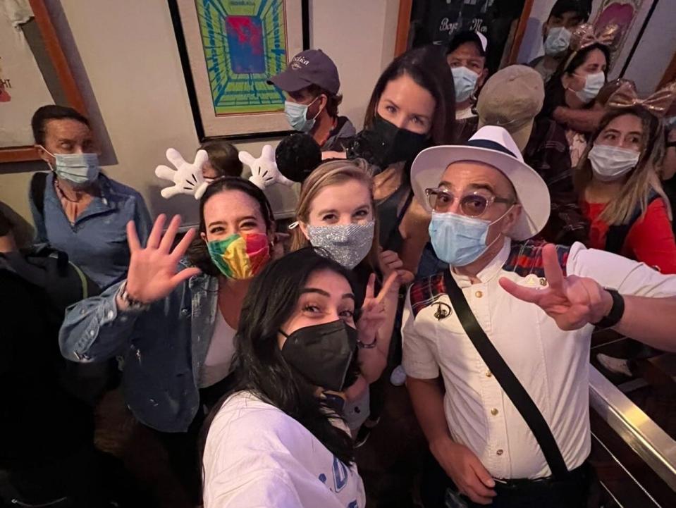 josie and group taking a selfie with their vip tour guide at disney world