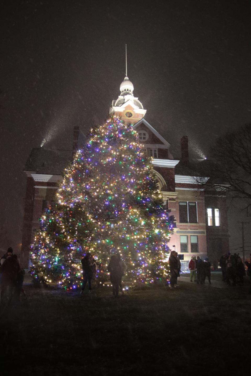 The Community Christmas Tree is pictured as snow falls Nov. 29, 2021, at the old Lenawee County Courthouse in Adrian shortly after it was lighted. This year's lighting is at 6:30 p.m. Monday, Nov. 28.