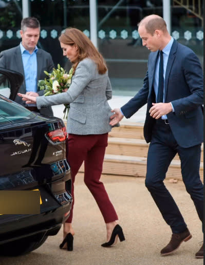 Kate Middleton's shoe falls off her foot in a wardrobe fail while Prince Williams comes to her aid while the pair leave the Shout's Crisis Volunteer celebration event at Troubadour White City Theatre on November 12, 2019