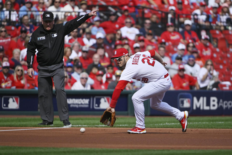 Oct 7, 2022; St. Louis, Missouri, USA; St. Louis Cardinals third baseman Nolan Arenado (28) fields a ground ball during the first inning against the Philadelphia Phillies during game one of the Wild Card series for the 2022 MLB Playoffs at Busch Stadium. Mandatory Credit: Jeff Curry-USA TODAY Sports