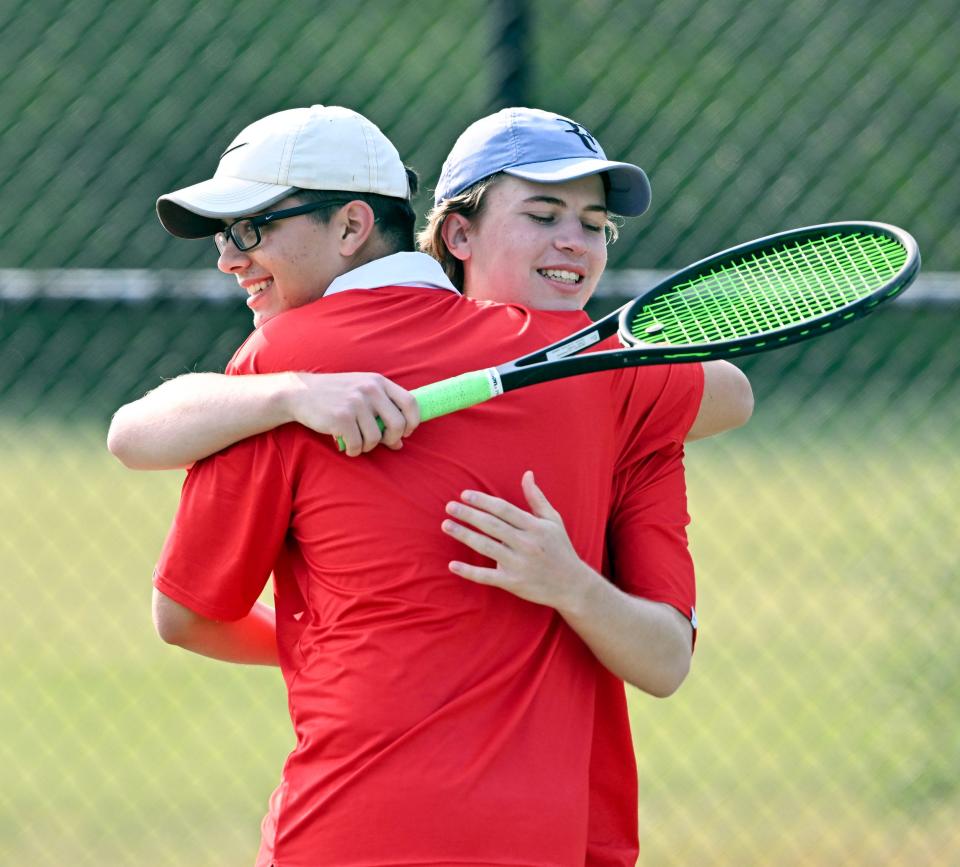 Barnstable brothers Alex and Eric (right) Arabadzhiev celebrate after defeating Monomoy on Monday, May 22, 2023.