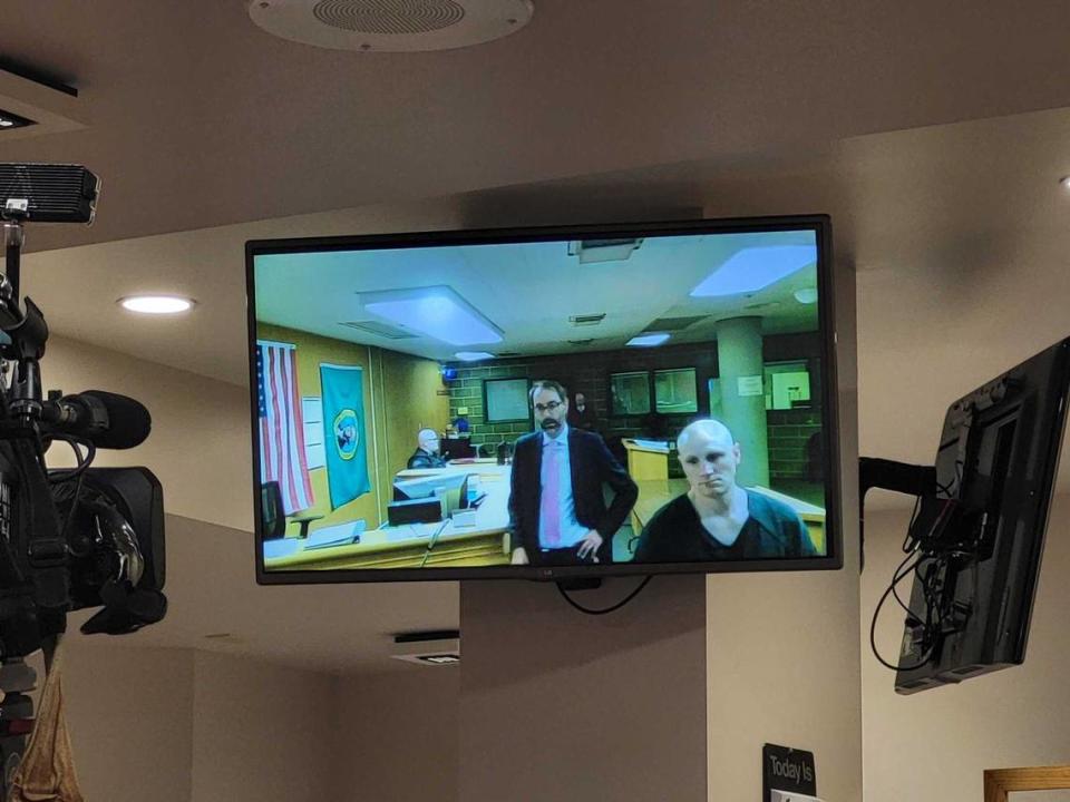 Cody Craig, right, appears by video Thursday, April 13, in Whatcom County Superior Court in Bellingham. With him is attorney Richard Larson, a public defender with the Whatcom County Public Defender’s Office. Craig, Michael Doane and Melissa Welch were booked into the Whatcom County Jail earlier Thursday on suspicion of first-degree murder in connection with the death of the 5-year-old daughter of Doane and Welch. The child died March 8 due to a “very high and fatal amount” of fentanyl in her bloodstream, according to police in Ferndale. Craig’s first appearance is set for Monday, April 17.