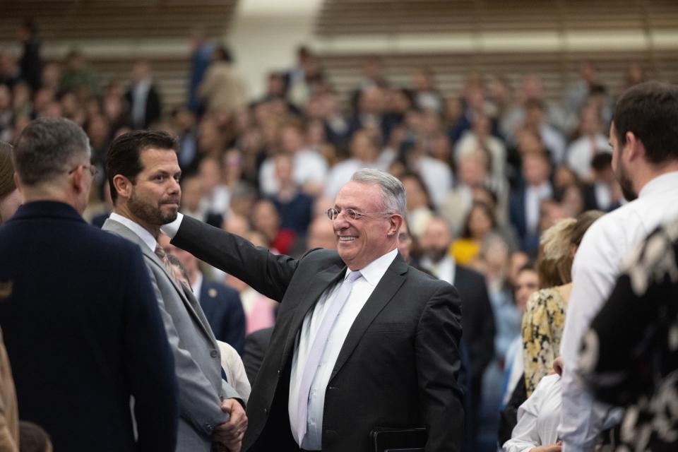 Elder Ulisses Soares of the Quorum of the Twelve Apostles greets visitors during a Portuguese devotional at the the George Albert Smith Fieldhouse in Provo on Sunday, Feb. 5, 2023. | Ryan Sun, Deseret News