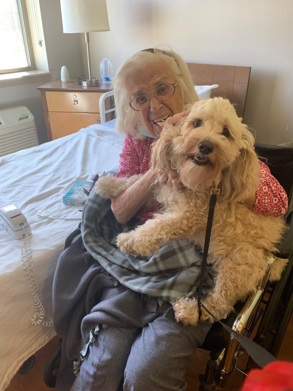 Regina Giczi receives a special visit from granddog Rascal.