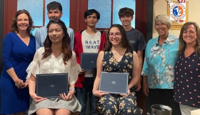 The Manatee River Rotary Club recently awarded five scholarships to Southeast High School International Baccalaureate students. Back row, from left, Principal Ginger Collins, Alan Morphin, Aiden Argueta, Aiden Letourneau, Manatee River Rotary president Beth Clark, and IB coordinator Kathy Grimm. In front are Yuxuan Guo and Alexia Fuentes.