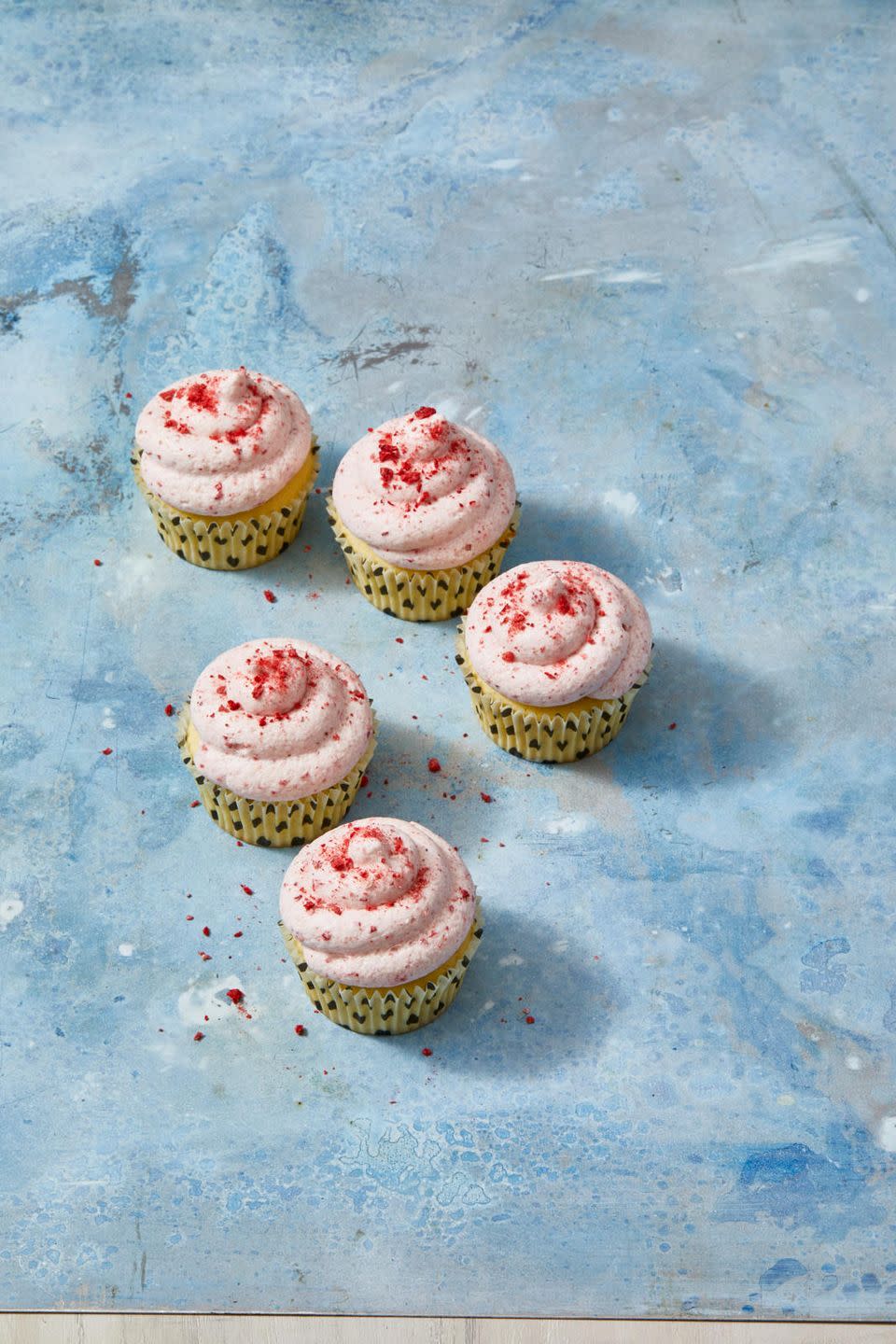 <p>Add a few extra freeze-dried strawberries to the buttercream frosting to turn it blood-thirsty red.</p><p>Get the <a href="https://www.goodhousekeeping.com/food-recipes/dessert/a31251488/lemon-cupcakes-with-strawberry-frosting-recipe/" rel="nofollow noopener" target="_blank" data-ylk="slk:Lemon Cupcakes With Strawberry Frosting recipe;elm:context_link;itc:0;sec:content-canvas" class="link "><strong>Lemon Cupcakes With Strawberry Frosting recipe</strong></a><em>. </em></p>