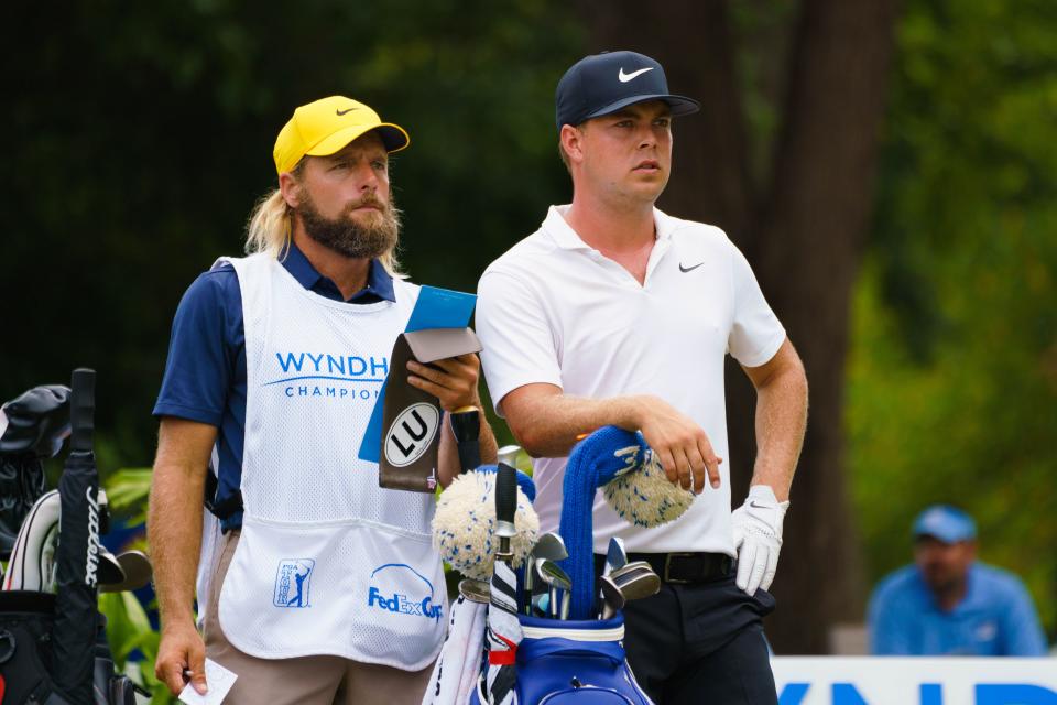 GREENSBORO, NC - AUGUST 18: Keith Mitchell talks with his caddie Pete Persolja during the third round of the Wyndham Championship on August 18, 2018, at Sedgefield Country Club in Greensboro, NC. (Photo by Jeremy McKnight/Icon Sportswire via Getty Images)
