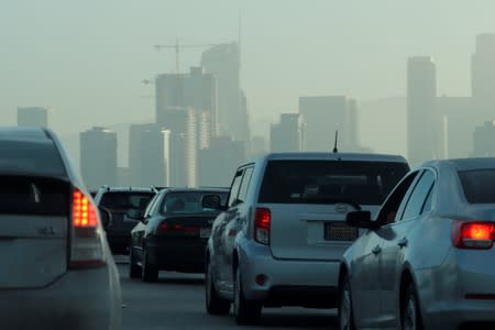 FILE PHOTO: Commuters navigate early morning traffic as they drive toward downtown in Los Angeles, California