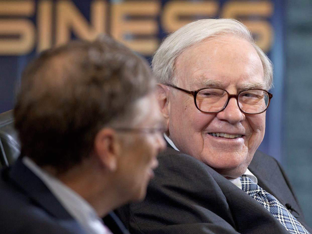 Warren Buffett, chairman and CEO of Berkshire Hathaway, right, listens to Microsoft founder and Berkshire board member Bill Gates during an interview with Liz Claman of the Fox Business Network in Omaha, Neb., Monday, May 7, 2012.