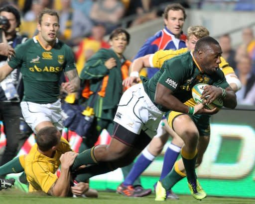 South Africa's Tendai Mtawarira (R) attempts a try during their Rugby Championship Test match vs Wallabies, in Perth, on September 8. South Africa are second on the championship table but have only one win to their credit, and have drawn and lost their last two games