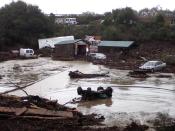 Cabins and vehicles are swept away by storm runoff at El Capitan Canyon Resort & Campground in Gaviota, Calif., on Friday, Jan. 20, 2017. A flood on the southern Santa Barbara County coast has swept cabins and vehicles down a narrow canyon as the latest storm drenches California. County Fire Department Capt. Dave Zaniboni says a creek overflowed at midmorning Friday and swept five cabins and 15 vehicles down the canyon which lies just above El Capitan State Beach. (Mike Eliason/Santa Barbara County Fire Dept. via AP)