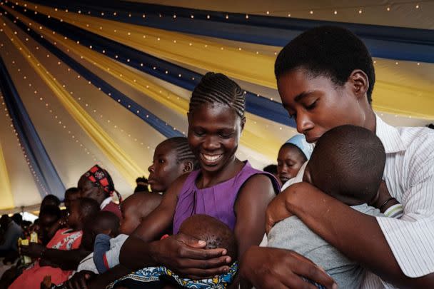 PHOTO: Mothers participate in the launch of the extension of the worlds first malaria vaccine (RTS, S) pilot program for children at risk of malaria illness and death within Kenyas lake-endemic region at Kimogoi Dispensary in Gisambai on March 7, 2023. (Yasuyoshi Chiba/AFP via Getty Images)