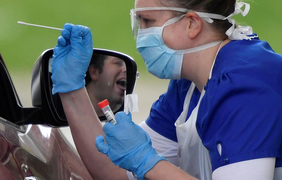  Medical staff are seen testing people at a coronavirus test centre in the car park of Chessington World of Adventures as the spread of the coronavirus disease (COVID-19) continues, Chessington, Britain, April 2, 2020. REUTERS/Toby Melville     TPX IMAGES OF THE DAY