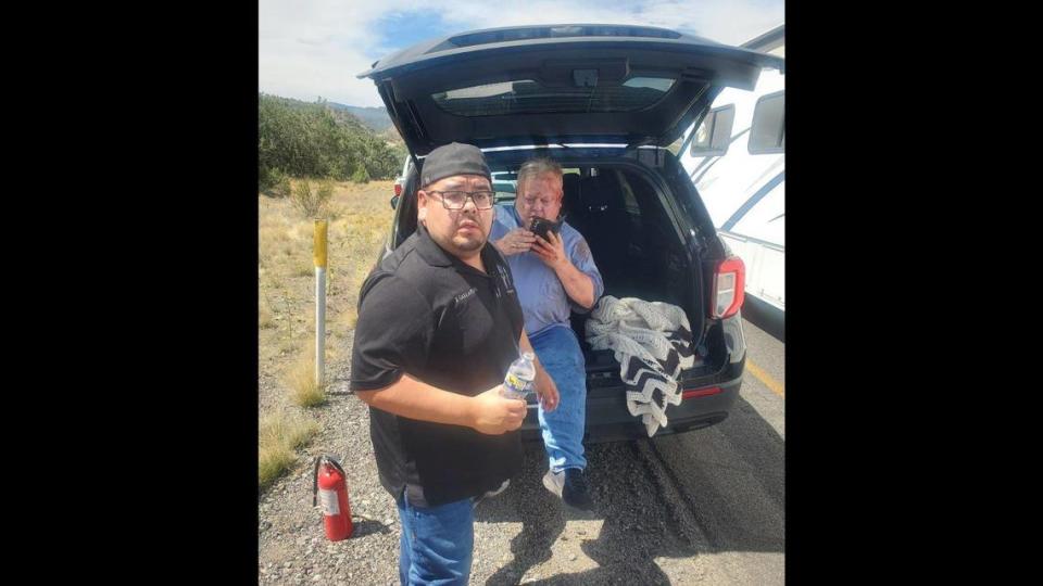 Gustine Police Department Reserve Officer Jose Gallardo, left, along with fellow reserve officers Luciano Zelvaggio and Emanuel Gonzalez, stopped and pulled a motorist from a crashed vehicle along Interstate 40 in Arizona while driving newly acquired police department vehicles back to California on Monday, Sept, 11, 2023, according to the Gustine Police Department. Image courtesy of Gustine Police Department.