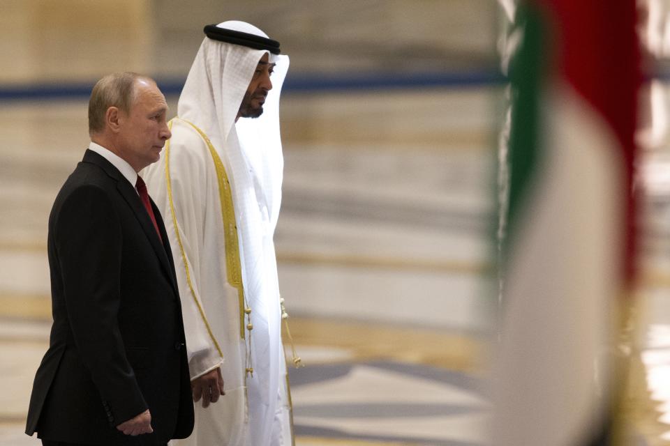 Russian President Vladimir Putin, left, and Abu Dhabi Crown Prince Mohamed bin Zayed al-Nahyan attend the official welcome ceremony in Abu Dhabi, United Arab Emirates, Tuesday, Oct. 15, 2019. (AP Photo/Alexander Zemlianichenko, Pool)