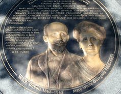 A medallion monument of a Black man and a white woman